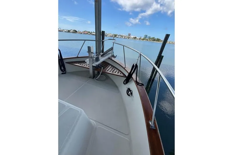  Yacht Photos Pics 2006 Mariner Orient boat deck with scenic waterfront view.