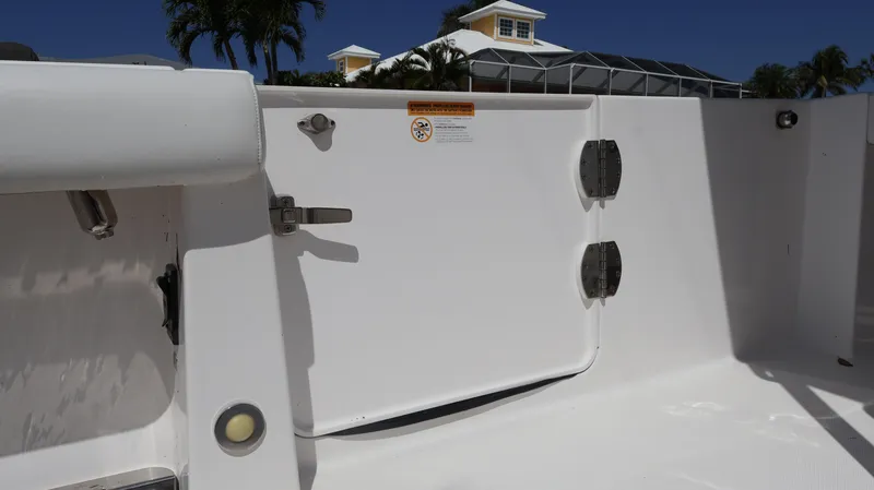  Yacht Photos Pics 2019 Everglades 435 Center Console boat interior with white panel and latch.