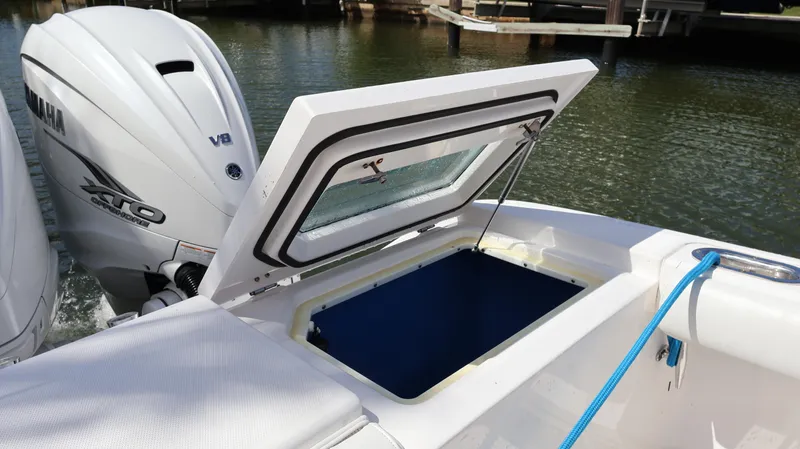 Yacht Photos Pics 2019 Everglades 435 Center Console boat with Yamaha V8 engine and open storage compartment.