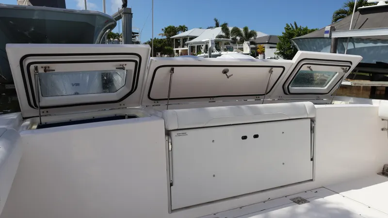 Yacht Photos Pics 2019 Everglades 435 Center Console boat with open storage compartments.