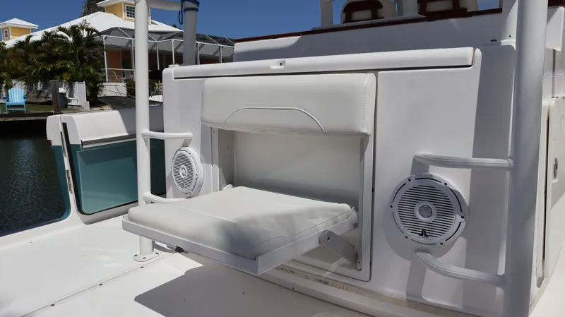  Yacht Photos Pics 2019 Everglades 435 Center Console boat with fold-out seat and speakers.