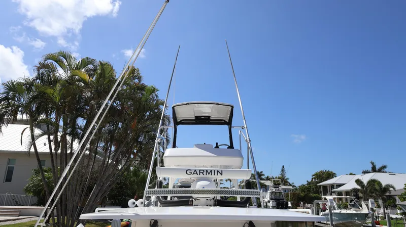  Yacht Photos Pics 2019 Everglades 435 Center Console boat with Garmin equipment, docked under a clear blue sky.