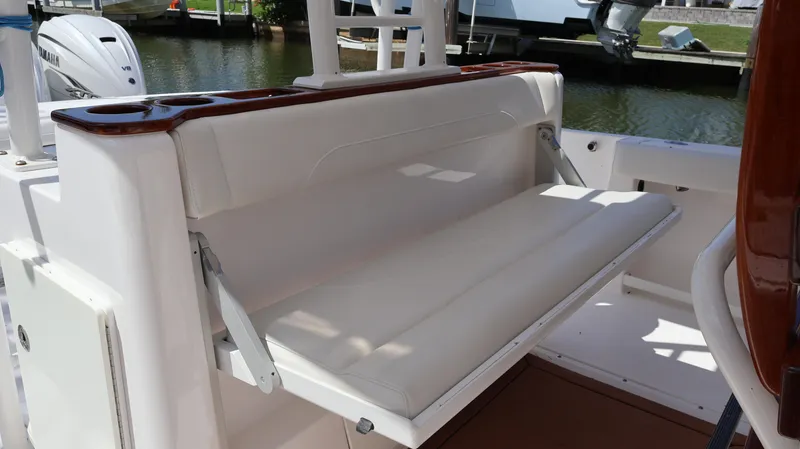  Yacht Photos Pics 2019 Everglades 435 Center Console boat with foldable white bench seat.