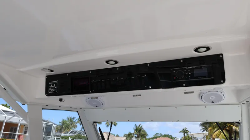  Yacht Photos Pics Interior view of 2019 Everglades 435 Center Console boat with control panel and speakers.