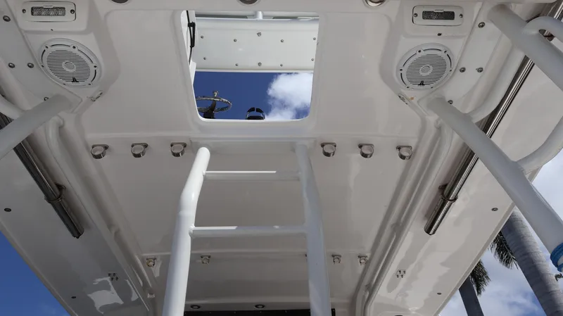  Yacht Photos Pics 2019 Everglades 435 Center Console boat interior with ladder and speakers, viewed from below.