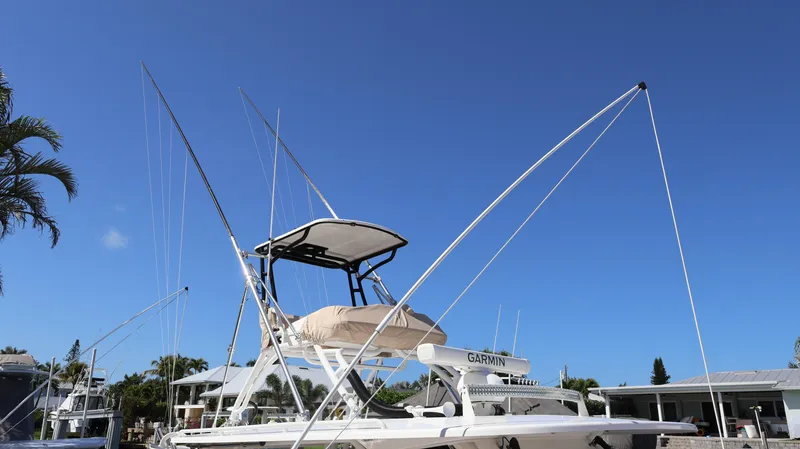  Yacht Photos Pics 2019 Everglades 435 Center Console boat docked under clear blue sky.
