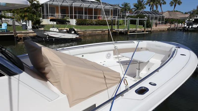  Yacht Photos Pics 2019 Everglades 435 Center Console boat docked near waterfront homes.