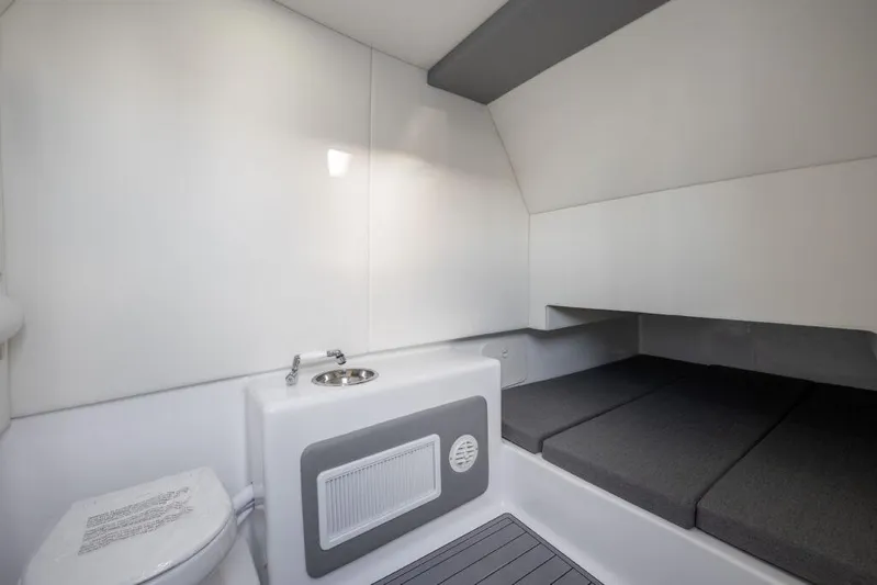  Yacht Photos Pics 2024 Front Runner 39 CC Custom boat interior with sink, toilet, and sleeping area.