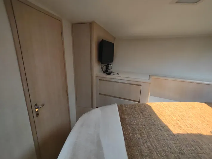  Yacht Photos Pics Interior of 1995 Hatteras 52 Cockpit Motor Yacht with TV and wooden cabinetry.