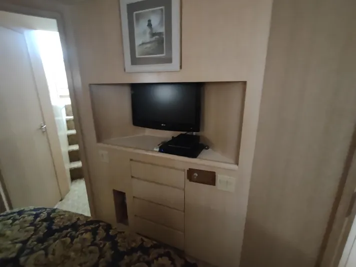  Yacht Photos Pics Interior of 1995 Hatteras 52 Cockpit Motor Yacht with TV and storage.