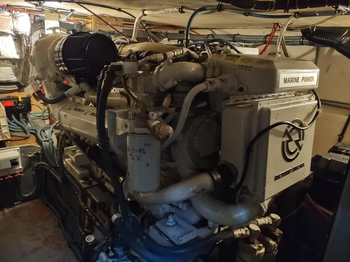  Yacht Photos Pics Engine room of 1995 Hatteras 52 Cockpit Motor Yacht, featuring Marine Power engine.