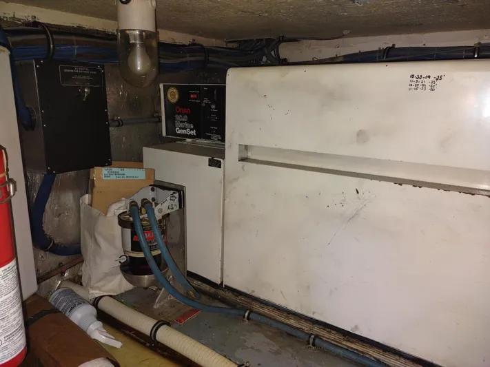  Yacht Photos Pics Engine room of 1995 Hatteras 52 Cockpit Motor Yacht with generator and equipment.