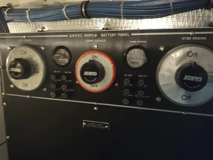  Yacht Photos Pics Battery panel of 1995 Hatteras 52 Cockpit Motor Yacht with switches and gauges.