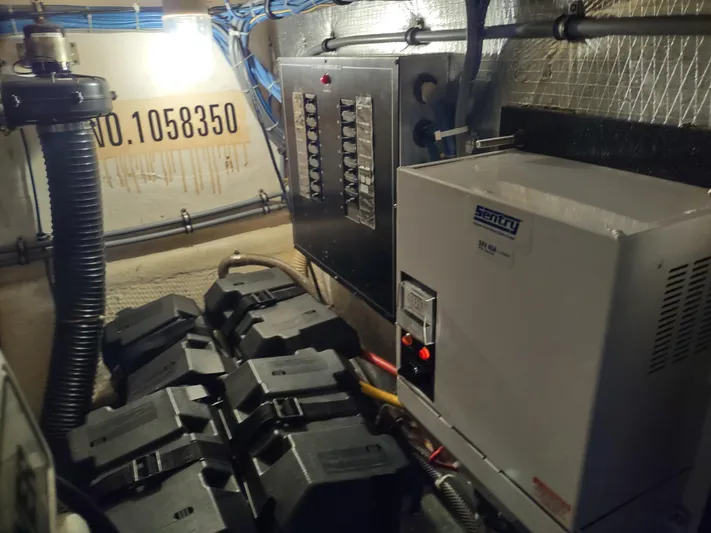  Yacht Photos Pics Engine room of 1995 Hatteras 52 Cockpit Motor Yacht with electrical panel and equipment.