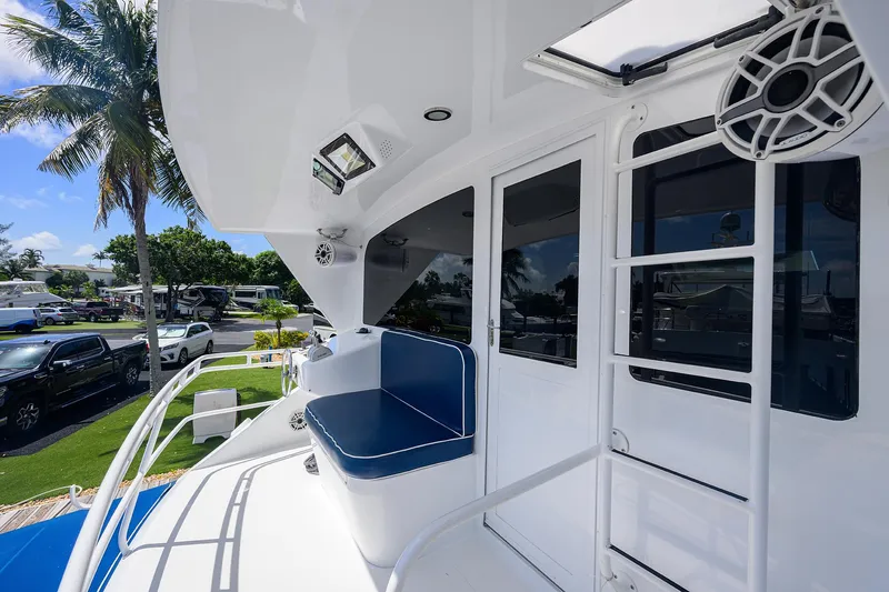  Yacht Photos Pics 2001 Viking 65 Enclosed Bridge yacht deck with seating and ladder.