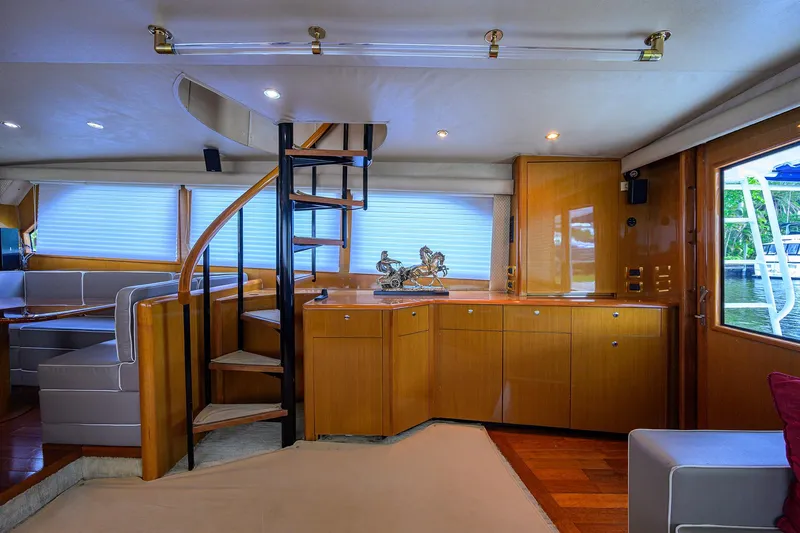  Yacht Photos Pics Luxurious interior of 2001 Viking 65 Enclosed Bridge yacht with spiral staircase.