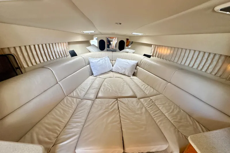  Yacht Photos Pics Interior cabin of 2006 Formula 370 Super Sport with plush beige seating and pillows.