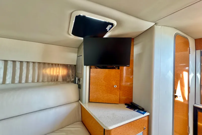  Yacht Photos Pics Interior of a 2006 Formula 370 Super Sport boat with TV and seating area.