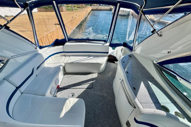  Yacht Photos Pics Interior of a 2006 Formula 370 Super Sport boat with white seating and blue accents.