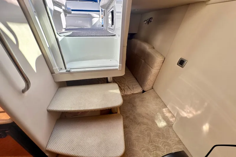  Yacht Photos Pics Interior cabin of 2006 Formula 370 Super Sport boat with stairs and seating area.