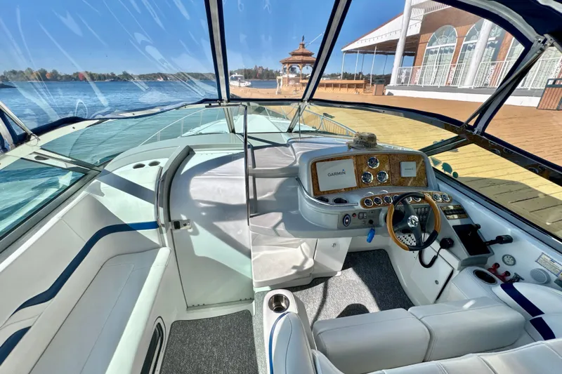  Yacht Photos Pics 2006 Formula 370 Super Sport boat interior with helm, steering wheel, and waterfront view.