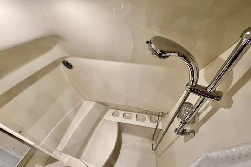  Yacht Photos Pics 2006 Formula 370 Super Sport boat shower with chrome fixtures and white interior.