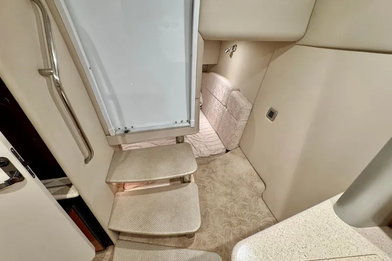  Yacht Photos Pics Interior of 2006 Formula 370 Super Sport boat, featuring stairs and cozy seating area.