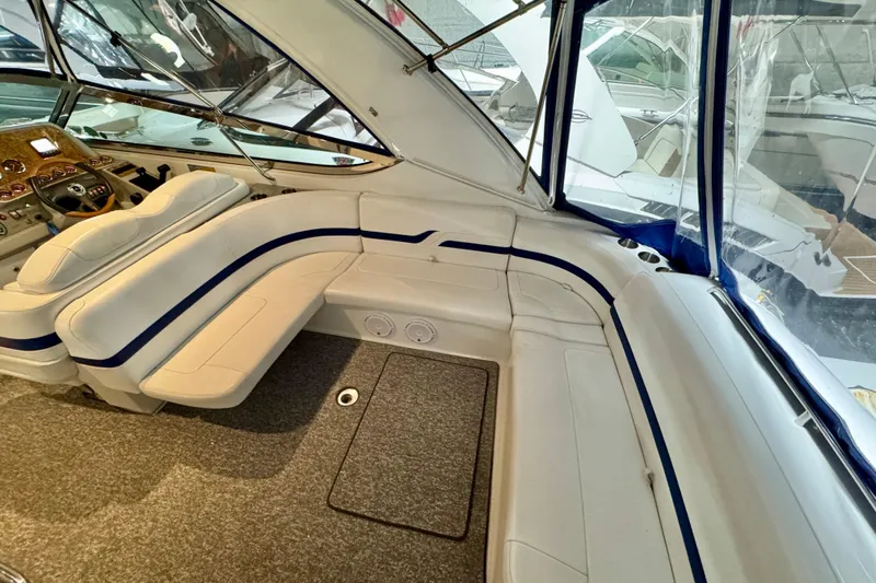  Yacht Photos Pics Interior of 2006 Formula 370 Super Sport boat with white seating and blue accents.