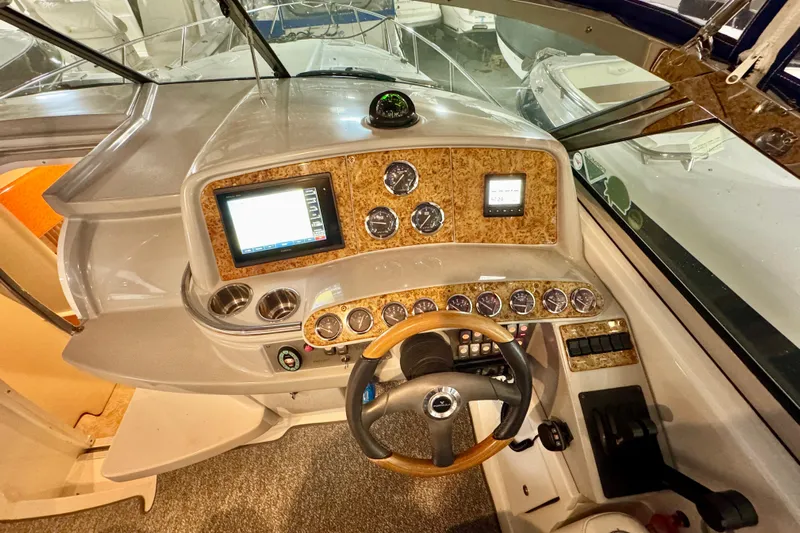  Yacht Photos Pics 2006 Formula 370 Super Sport boat dashboard with wood accents and modern controls.
