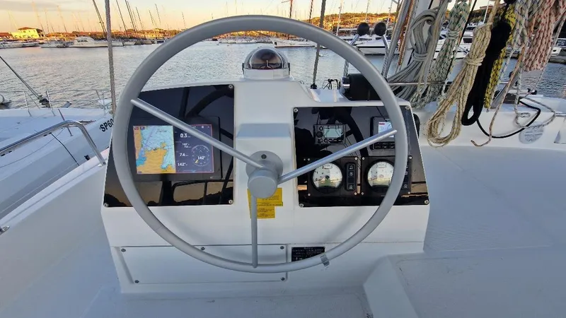  Yacht Photos Pics Steering wheel and navigation controls on a 2022 Bali 4.6 yacht.