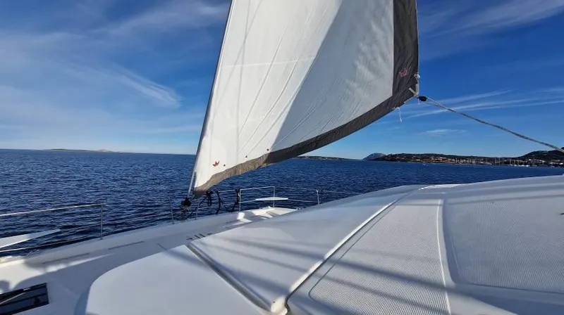  Yacht Photos Pics Sailing on a 2022 Bali 4.6 catamaran under clear blue skies.