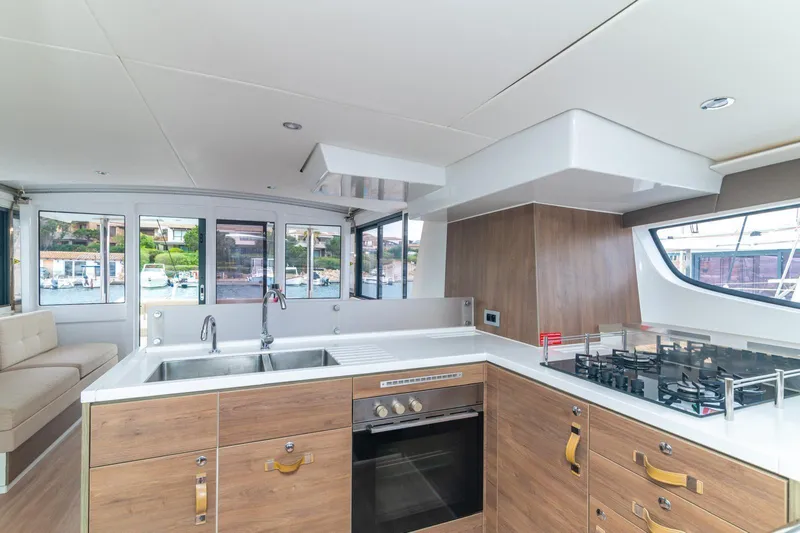  Yacht Photos Pics Modern kitchen interior on a 2022 Bali 4.6 yacht, featuring sleek design and appliances.