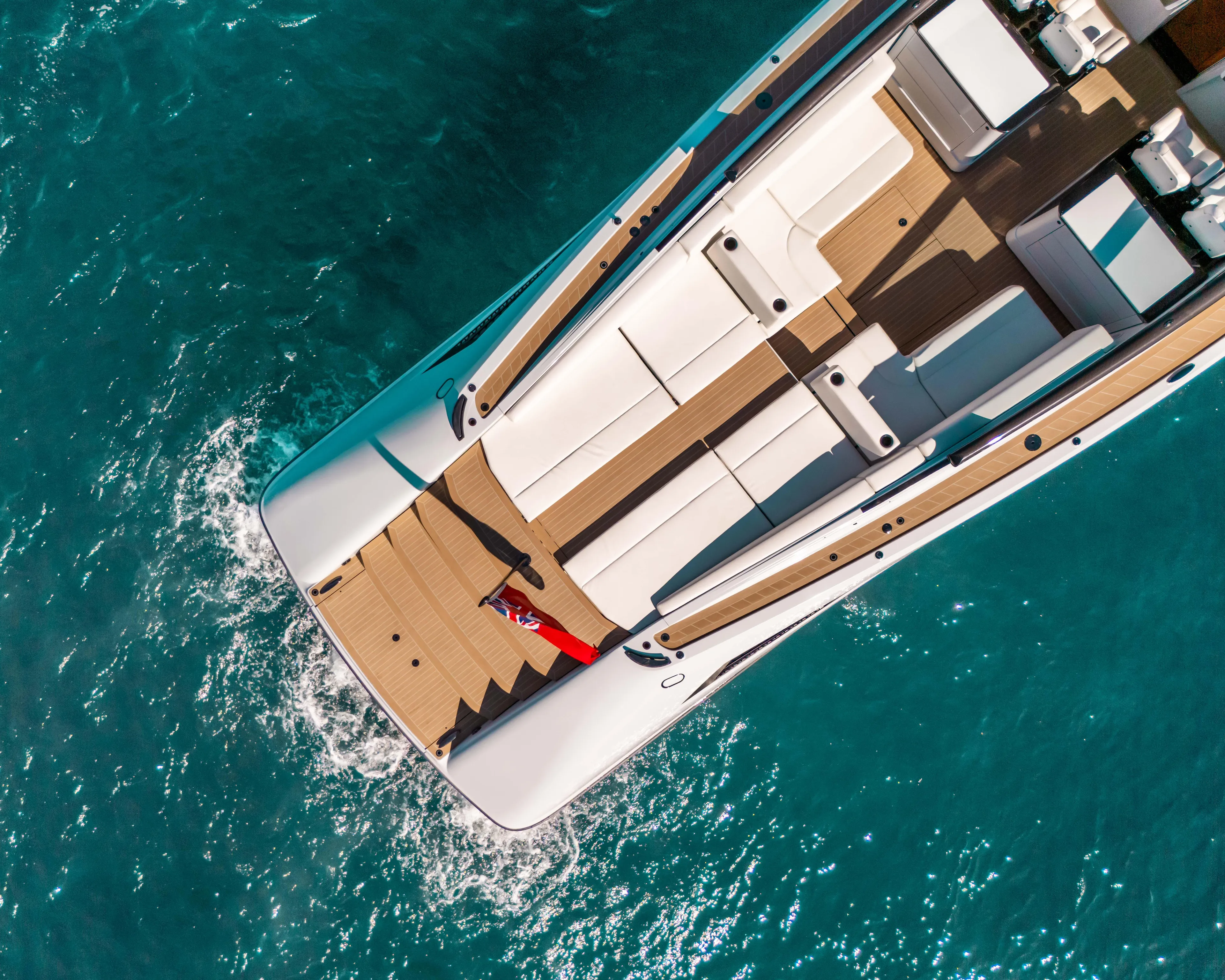 Greenwich Yacht Photos Pics Aerial view of 2022 Wajer 55 yacht cruising on clear blue water.