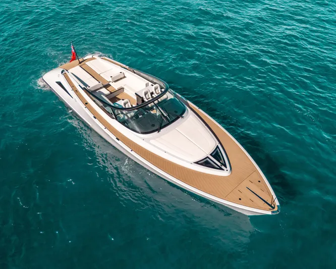 Greenwich Yacht Photos Pics Luxury 2022 Wajer 55 yacht cruising on clear blue ocean waters.