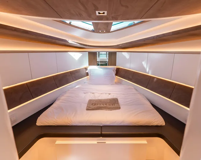 Greenwich Yacht Photos Pics Luxurious interior cabin of 2022 Wajer 55 yacht with elegant bedding.