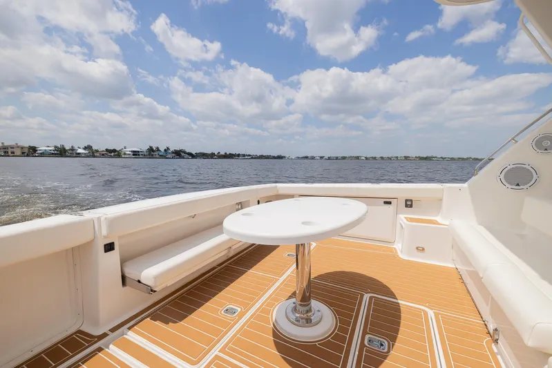 Mar's Bar Yacht Photos Pics 2000 Tiara Yachts Open model boat with spacious deck and scenic water view.