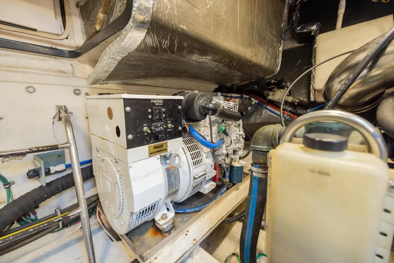 Mar's Bar Yacht Photos Pics Engine room of a 2000 Tiara Yachts Open model with generator and wiring.