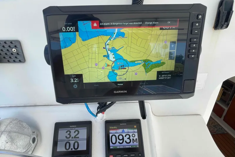 Acushla Yacht Photos Pics Garmin navigation system on Lagoon 410-S2, 2003 model, displaying nautical map and AIS alarm.