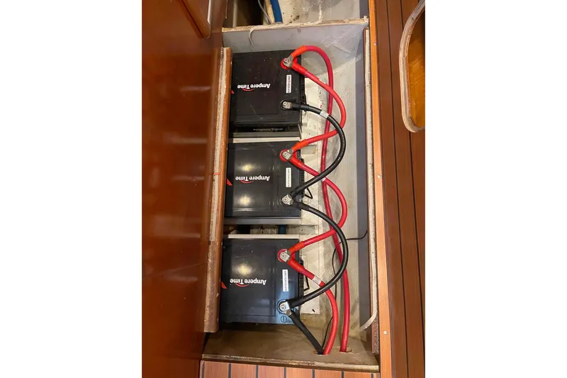 Acushla Yacht Photos Pics Battery compartment of a 2003 Lagoon 410-S2 with connected cables.