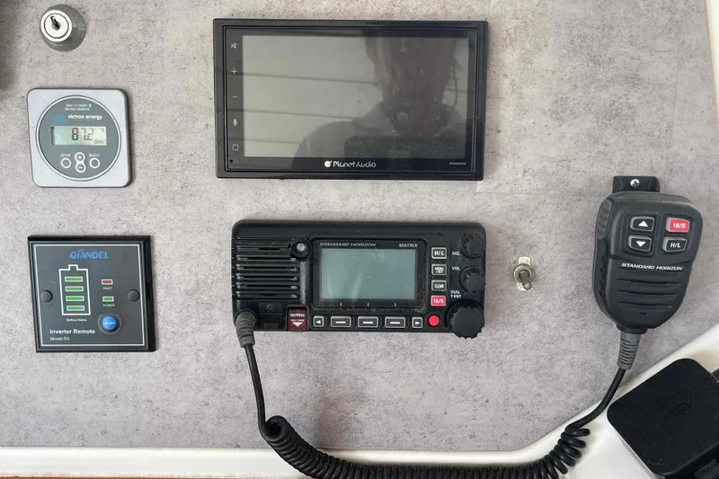 Acushla Yacht Photos Pics Control panel of a 2003 Lagoon 410-S2 with radio and inverter remote.