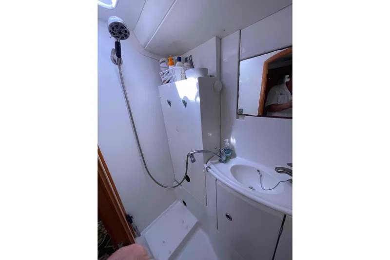 Acushla Yacht Photos Pics Bathroom interior of 2003 Lagoon 410-S2 yacht with shower and sink.