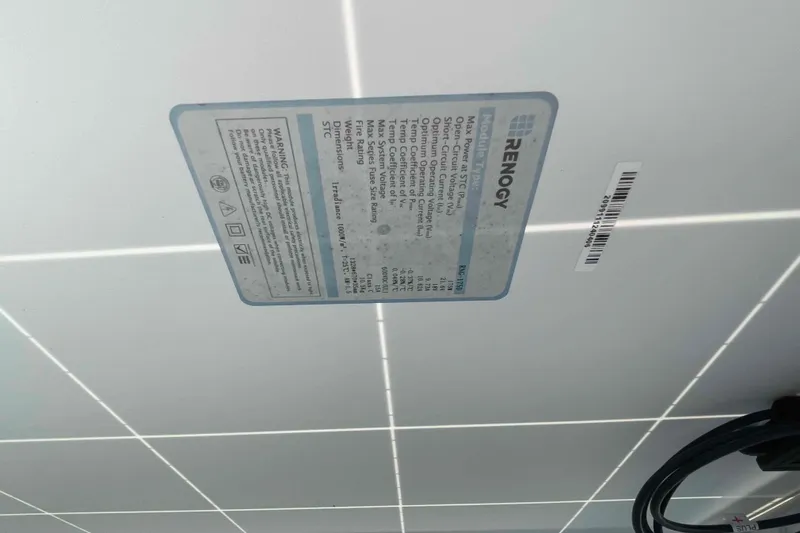 Acushla Yacht Photos Pics Renogy solar panel label on Lagoon 410-S2, 2003 model, showing specifications and warnings.