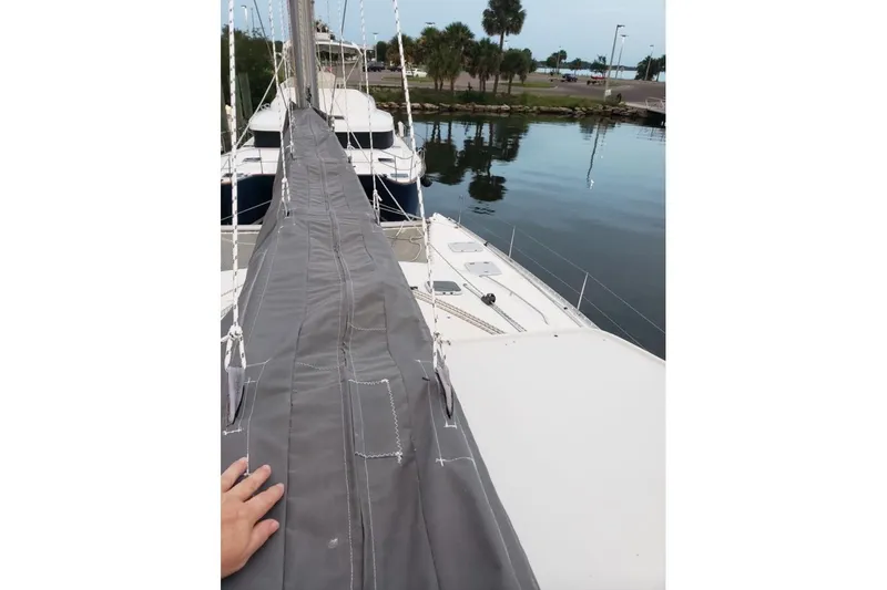 Acushla Yacht Photos Pics 2003 Lagoon 410-S2 catamaran docked, view of deck and mast cover.