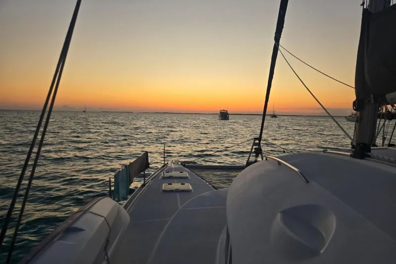 Acushla Yacht Photos Pics Sunset view from a 2003 Lagoon 410-S2 catamaran on the ocean.