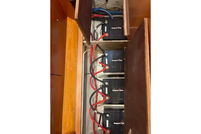Acushla Yacht Photos Pics Battery compartment of 2003 Lagoon 410-S2 with Ampere Time batteries and wiring.