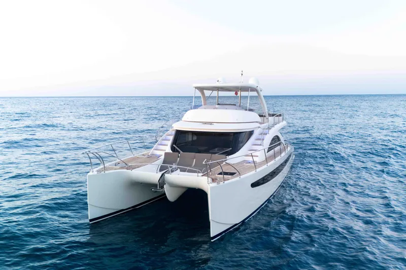 013 Yacht Photos Pics Luxurious 2008 Custom 62 yacht cruising on open sea, showcasing sleek design and elegance.