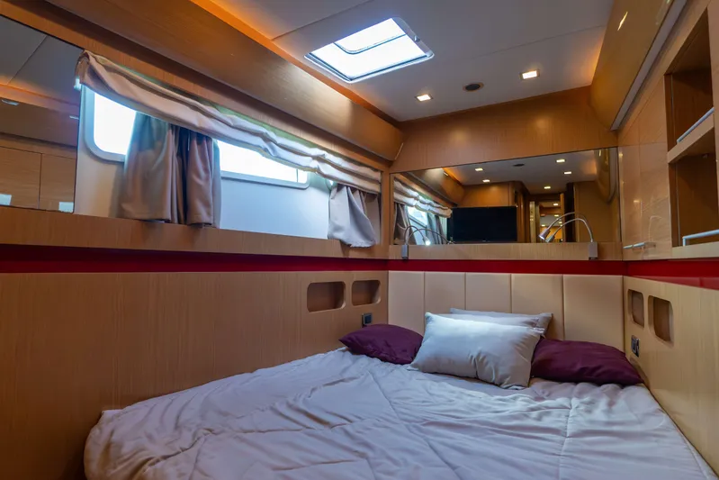 013 Yacht Photos Pics Luxurious cabin interior of 2008 VG 62 yacht with cozy bedding and modern lighting.