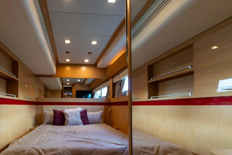 013 Yacht Photos Pics Luxurious bedroom interior in 2008 VG 62 yacht with modern lighting and cozy bedding.