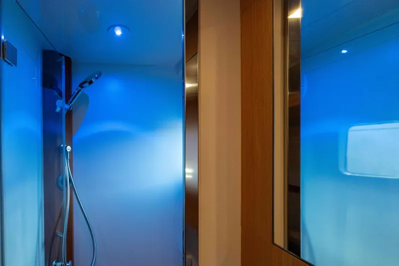 013 Yacht Photos Pics Modern shower area with blue ambient lighting in a 2008 VG 62 model.