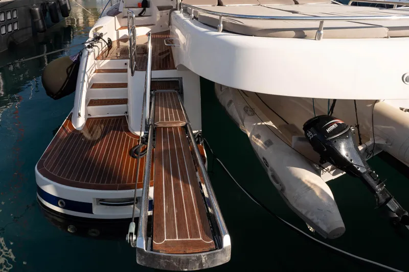 013 Yacht Photos Pics Luxury yacht VG 62 (2008) with wooden deck and attached inflatable boat.